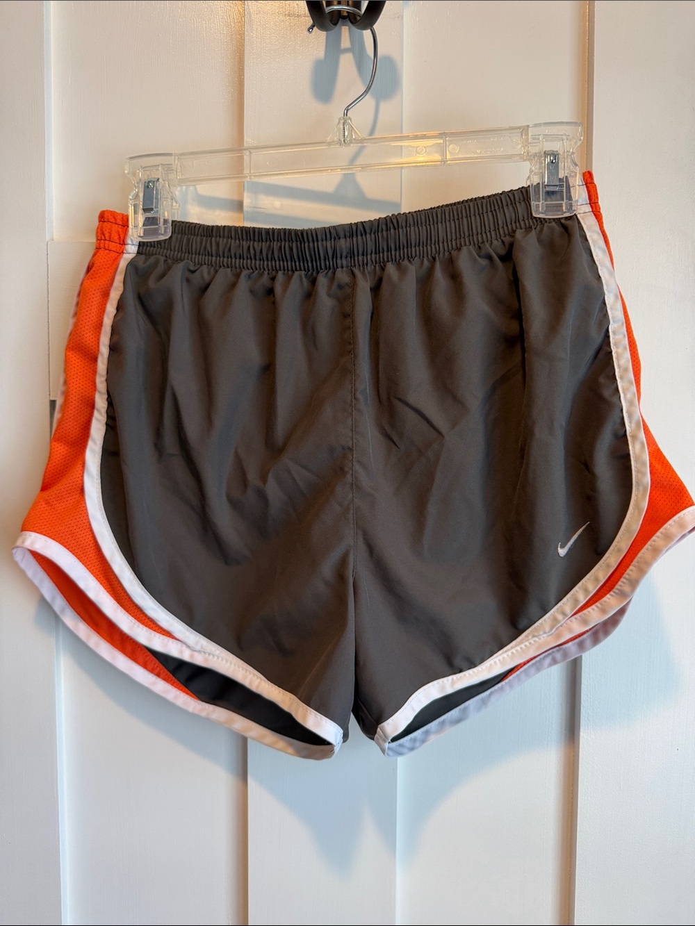 Nike Women's Dark Gray Athletic Shorts with Orange Panels and White Trim